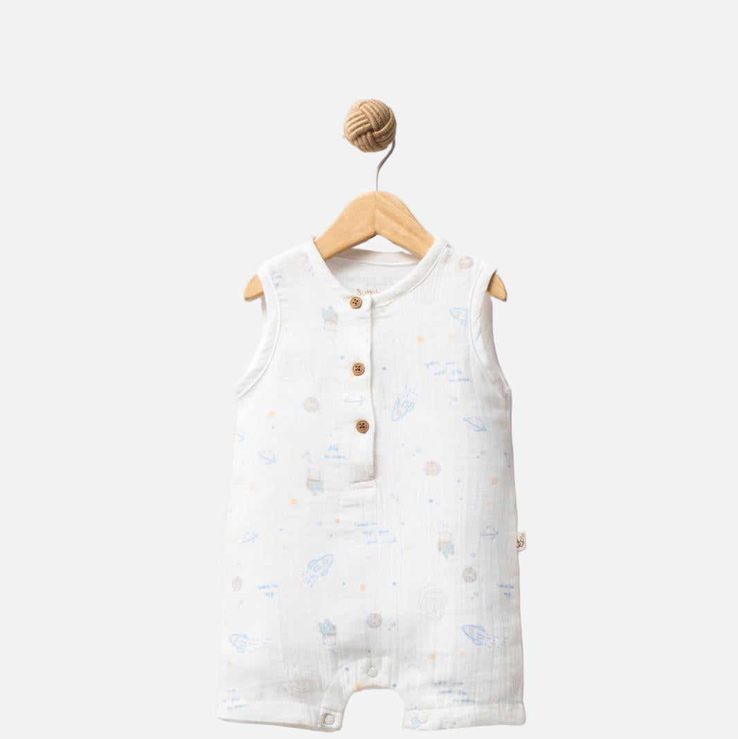 Baby romper with star pattern on a hanger against a white background