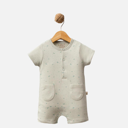 Baby romper with short sleeves and legs on a wooden hanger against a white background