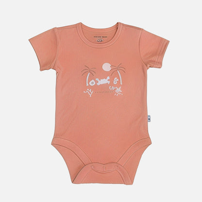 Peach-colored baby onesie with a graphic design on a white background