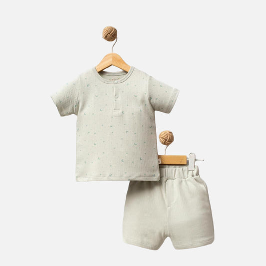 Children's outfit with shirt and shorts on a white background, branded 'Shiny Moon'.