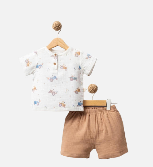 Children's outfit with white shirt and brown shorts on a white background, featuring 'Tractor' design.