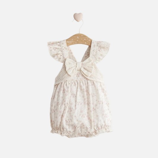 Baby romper with floral pattern on a white background
