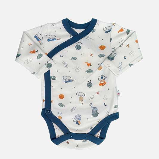 Baby onesie with a pattern of cartoon characters on a white background